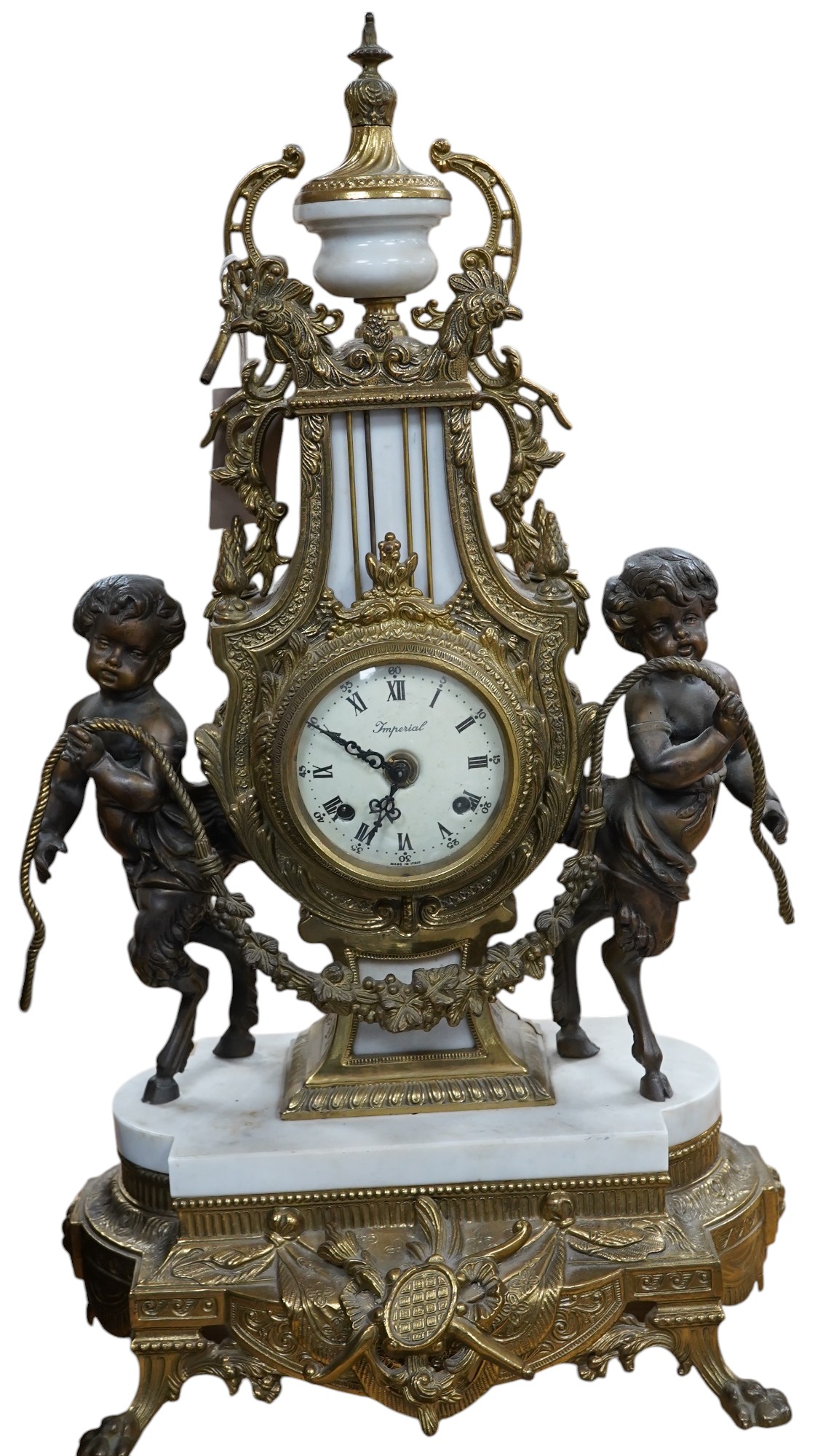 A Louis XV style brass and marble mantel clock, with key, 60cm tall. Condition - good